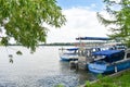 Docked boats on Herastrau Park Lake are waiting the tourists for sail Royalty Free Stock Photo