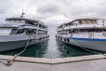 Docked Duo: Wide-Angle View of Two Ships Moored at a Concrete Port
