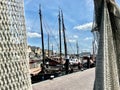 Docked fishing boats and sailboats in the port of Urk.