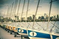 Docked sailing boats on a Charles River with view of Boston skyscrapers Royalty Free Stock Photo