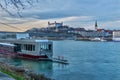 Docked ship at Danube river bank and Bratislava castle Royalty Free Stock Photo