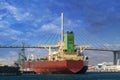 Docked ship with the Long Beach International Gateway Bridge in the background Royalty Free Stock Photo