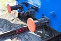 The docking part of the railway carriage is blue. Close-up of an iron train. Royalty Free Stock Photo