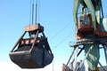 Dockside cargo crane loads coal at river port Kolyma Royalty Free Stock Photo