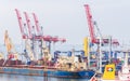 Dockyard cranes load heavy bulk carrier Royalty Free Stock Photo