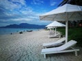 Doclet beach Doc Let in Nha Trang Vietnam. seaside. white sunbeds and umbrellas by the sea Royalty Free Stock Photo