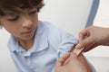 Doctor Applying Bandage On Patient's Arm