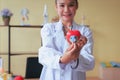 Doctor asian woman hands holding stethoscope and heart red model,Happy and smiling,Selective focus Royalty Free Stock Photo