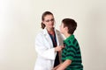 Doctor assessing patient by stethoscope Royalty Free Stock Photo