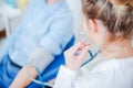 Doctor Assistant Checking Blood Pressure Of Patient