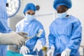 Doctor and assistant nurse operating for help patient from dangerous emergency case .Surgical instruments on the sterile table in Royalty Free Stock Photo