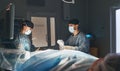 Doctor and an assistant in operating room for surgical clinic