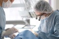 Doctor with an assistant in the surgical dental surgery Royalty Free Stock Photo