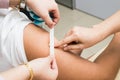 Doctor attaching a plaster onto patient arm after injection