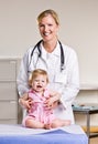 Doctor and baby girl in doctor office Royalty Free Stock Photo