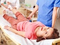 Doctor bandaging patient in hospital. Royalty Free Stock Photo
