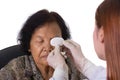 Doctor bandaging patient's eye Royalty Free Stock Photo