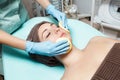 Doctor beautician cleanses skin woman with sponge. cosmetology treatment skincare face. Spa procedures Royalty Free Stock Photo