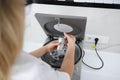 Doctor beautician puts a test tube in a metal container. Preparation for the plasmolifting procedure.