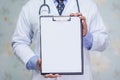 Doctor with blank clipboard for note diagnosis of patients in nursing hospital ward