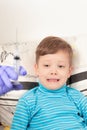 Doctor in blue medical gloves injects a sick child with a syringe