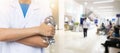 Doctor on blurred hospital counter and nurses Royalty Free Stock Photo