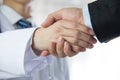 Doctor and businessman shaking hands Royalty Free Stock Photo