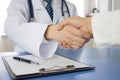 Doctor and businessman shaking hands Royalty Free Stock Photo