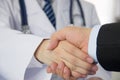 Doctor and businessman shaking hands Royalty Free Stock Photo