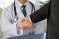 Doctor and businessman shaking hands Royalty Free Stock Photo