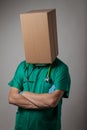 Doctor with cardboard box head Royalty Free Stock Photo