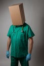 Doctor with cardboard box head Royalty Free Stock Photo