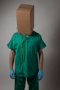 Doctor with cardboard box head Royalty Free Stock Photo