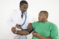 Doctor Checking Blood Pressure Of An Obese Patient Royalty Free Stock Photo