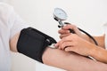 Doctor Checking Blood Pressure Of Patient Royalty Free Stock Photo