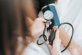 Doctor checking blood pressure of a patient with sphygmomanometer Royalty Free Stock Photo