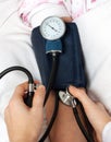 Doctor checking blood pressure Royalty Free Stock Photo