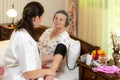 Doctor checking blood pressure to senior woman Royalty Free Stock Photo