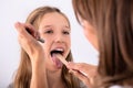Doctor Checking Girl`s Sore Throat Royalty Free Stock Photo
