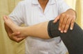 Doctor checking the knee joint Royalty Free Stock Photo