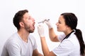 Doctor Checking Man`s Sore Throat Royalty Free Stock Photo