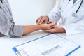 Doctor checking measuring pressure on patient`s hand pulse by hands, Medical and healthcare concept Royalty Free Stock Photo