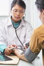 Doctor checking patient blood pressure Royalty Free Stock Photo