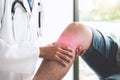 Doctor checking patient with knees to determine the cause of ill Royalty Free Stock Photo