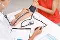 Doctor checking patient`s blood pressure Royalty Free Stock Photo