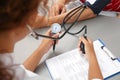 Doctor checking patient`s blood pressure Royalty Free Stock Photo