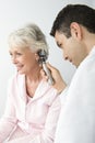 Doctor Checking Patient's Ear Using Otoscope