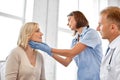 Doctor checking patient`s tonsils at hospital Royalty Free Stock Photo