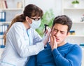 Doctor checking patients ear during medical examination Royalty Free Stock Photo