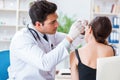 The doctor checking patients ear during medical examination Royalty Free Stock Photo